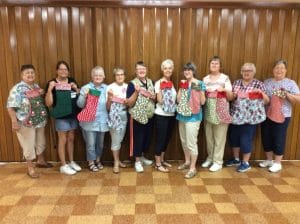 Women at Roseville Christian Church show off their Stockings of Joy