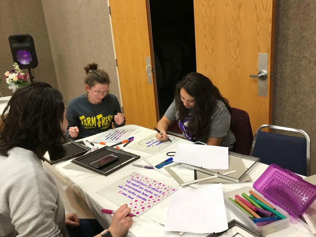 College Women created word art pictures using a reverse painting process.