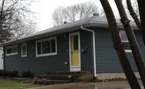 A house with a  yellow door.