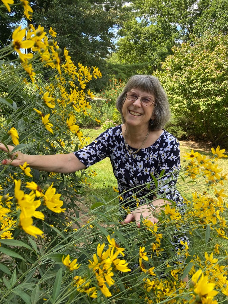 Karen Wingate with yellow flowers